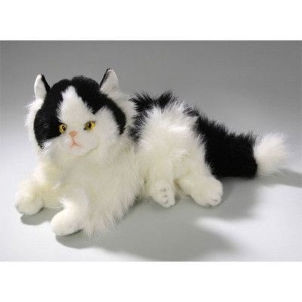 Lying black and white Persian cat 30 cm